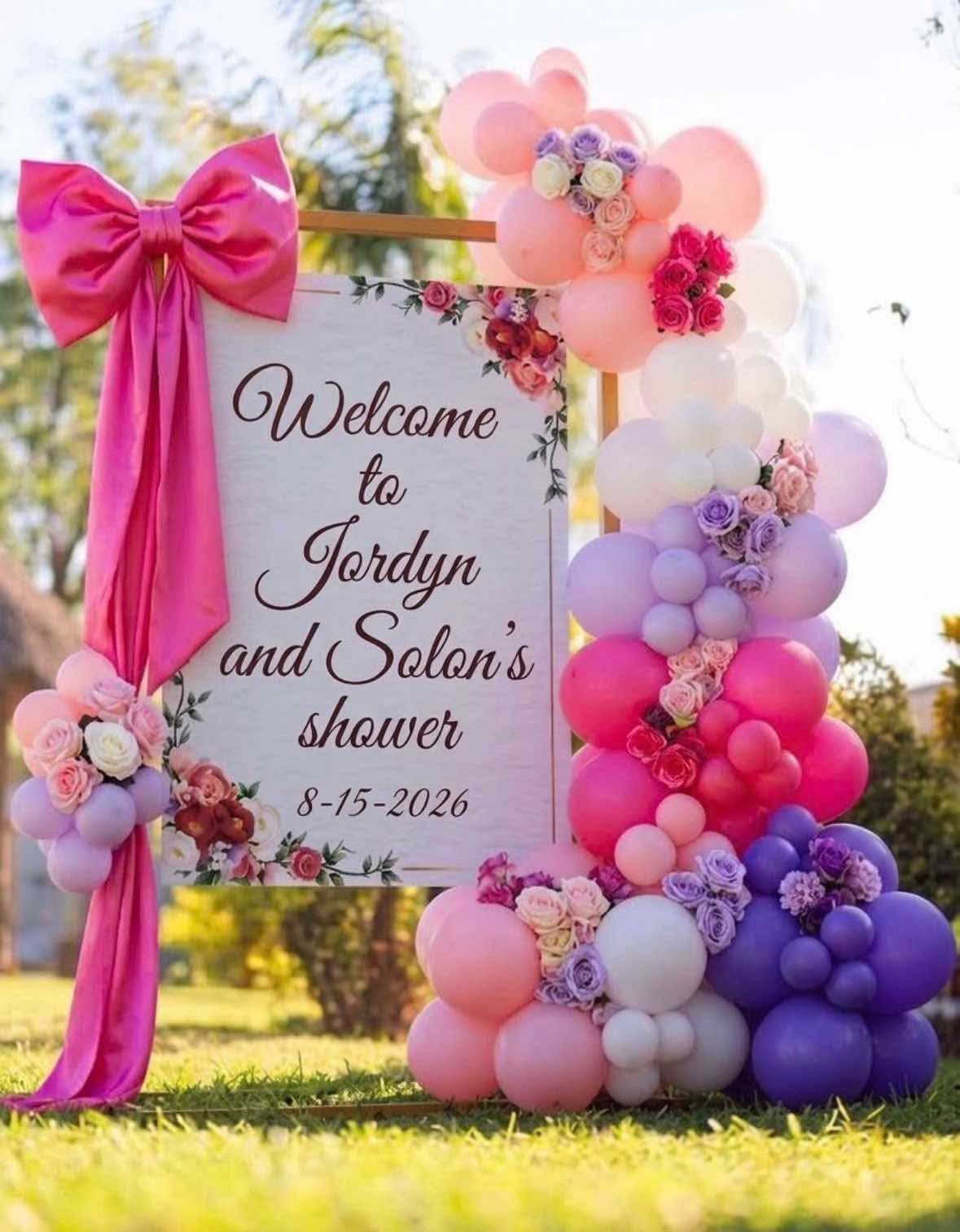 A pink satin bow and a cascade of pink, lilac and purple balloons studded with roses around a gold-framed “welcome to Jordyn and Solon's shower” sign on a lawn